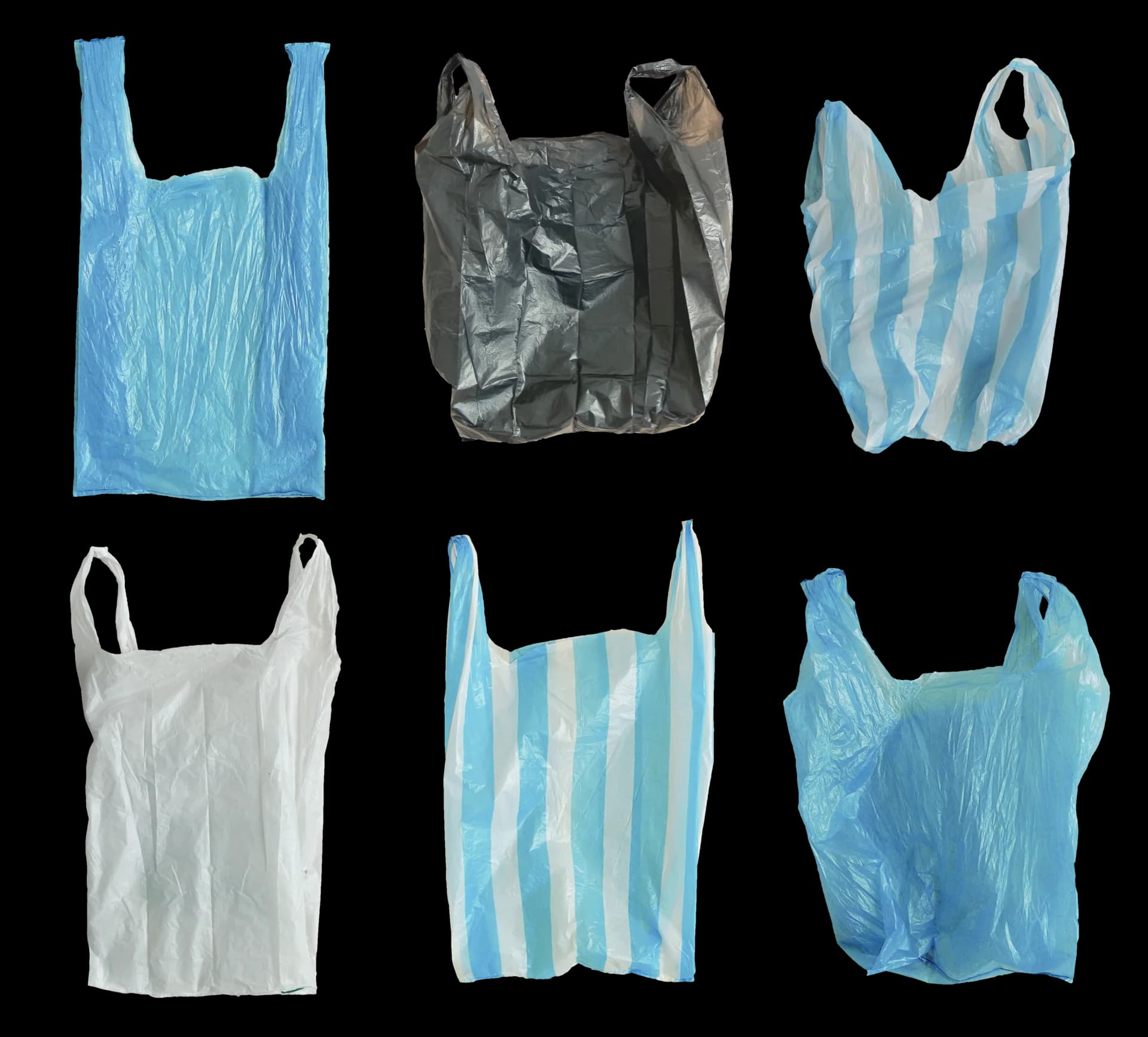 Sacolas comerciais plásticas de diferentes cores lado a lado