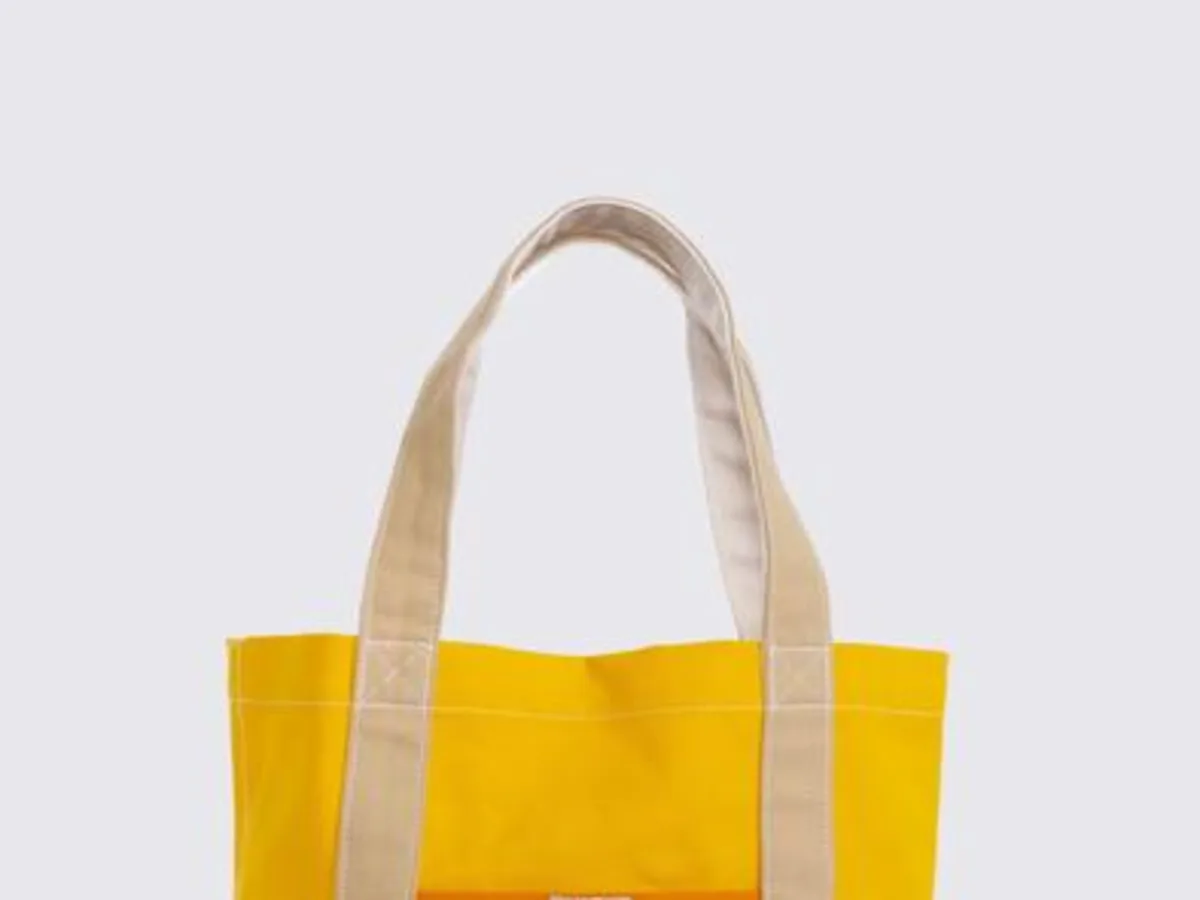 Ecobag amarela com alças claras, sem texto legível